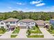 Two-story house with gray siding, landscaping, and a two-car garage at 12941 Wildflower Meadow Dr, Riverview, FL 33579