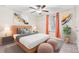 Bright bedroom with ceiling fan, window treatments, and stylish decor at 12941 Wildflower Meadow Dr, Riverview, FL 33579