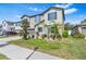 Two-story house with gray siding, landscaping, and a two-car garage at 12941 Wildflower Meadow Dr, Riverview, FL 33579