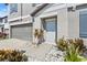 House exterior showing front door, landscaping, and attached garage at 12941 Wildflower Meadow Dr, Riverview, FL 33579