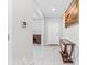View of entryway with tile floors, console table, and interior doors at 12941 Wildflower Meadow Dr, Riverview, FL 33579