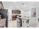 Island kitchen with granite countertops and stainless steel appliances at 12941 Wildflower Meadow Dr, Riverview, FL 33579