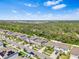 Community of two story houses with gray siding and landscaped yards at 12941 Wildflower Meadow Dr, Riverview, FL 33579