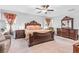 Bright bedroom featuring a king-size bed and matching furniture at 12941 Wildflower Meadow Dr, Riverview, FL 33579