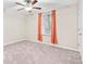 Spacious bedroom with ceiling fan and neutral carpeting at 12941 Wildflower Meadow Dr, Riverview, FL 33579
