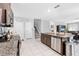 Open concept kitchen with island, granite, and stainless steel appliances at 12941 Wildflower Meadow Dr, Riverview, FL 33579