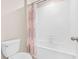 Clean bathroom with shower/tub combo and patterned curtain at 12941 Wildflower Meadow Dr, Riverview, FL 33579