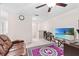 Spacious loft area with a comfy couch and large TV at 12941 Wildflower Meadow Dr, Riverview, FL 33579