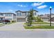 Two-story house with gray siding, landscaping, and a two-car garage at 12941 Wildflower Meadow Dr, Riverview, FL 33579
