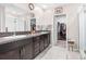 Double vanity bathroom with a large walk-in shower and closet at 12941 Wildflower Meadow Dr, Riverview, FL 33579