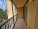 Spacious screened balcony overlooking treetop views at 3076 Eastland Blvd # 209, Clearwater, FL 33761