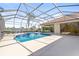 Enjoy this lovely screened pool and spa with lake view at 7925 Royal Queensland Way, Lakewood Ranch, FL 34202