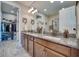Bathroom boasts double sinks, granite counters, and access to walk-in closet at 2001 Palm Key Ave, Oldsmar, FL 34677