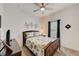 Serene bedroom with a bed, ceiling fan, and coastal decor at 5521 Limelight Dr, Apollo Beach, FL 33572