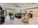 Open living room and kitchen with ample natural light at 5521 Limelight Dr, Apollo Beach, FL 33572