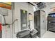 Garage with electrical panel, water softener, and storage cabinets at 5521 Limelight Dr, Apollo Beach, FL 33572