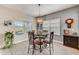 Charming dining area with round table and four chairs at 5521 Limelight Dr, Apollo Beach, FL 33572