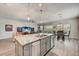 Open concept kitchen with large island and breakfast bar at 5521 Limelight Dr, Apollo Beach, FL 33572