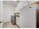 Bright laundry room with washer, dryer, and extra fridge at 5521 Limelight Dr, Apollo Beach, FL 33572