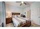 Comfortable bedroom with a bed, ceiling fan, and an adjacent closet at 5521 Limelight Dr, Apollo Beach, FL 33572