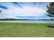 Serene lake view with lush green landscape at 5521 Limelight Dr, Apollo Beach, FL 33572