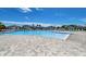 Large community pool with plenty of lounge chairs at 5521 Limelight Dr, Apollo Beach, FL 33572