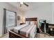 Comfortable bedroom with a bed, ceiling fan, and an adjacent closet at 5521 Limelight Dr, Apollo Beach, FL 33572