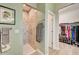 Clean bathroom with walk-in shower and access to walk-in closet at 5521 Limelight Dr, Apollo Beach, FL 33572