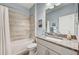 Clean bathroom with tub, shower, and granite countertop at 5521 Limelight Dr, Apollo Beach, FL 33572