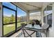 Relaxing screened porch with seating area and grill at 5521 Limelight Dr, Apollo Beach, FL 33572