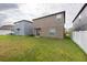 Spacious backyard with grassy lawn and privacy fence at 10348 Blue Plume Ct, Riverview, FL 33578