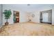 Open floor plan showcasing a spacious living room with neutral carpet at 2342 Hazelwood Ln, Clearwater, FL 33763