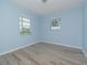 Spacious bedroom with light walls and wood-look flooring at 4406 W Wallcraft Ave, Tampa, FL 33611