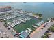 Aerial view of a marina filled with boats and surrounded by water at 468 Limewood Ave, Dunedin, FL 34698