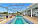 Relaxing pool and spa with covered patio, perfect for entertaining at 410 Islebay Dr, Apollo Beach, FL 33572