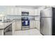 Well-equipped kitchen featuring granite countertops and stainless steel appliances at 12049 Hoosier Ct # 202, Hudson, FL 34667