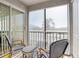 Relaxing lanai with wicker furniture and view at 12049 Hoosier Ct # 202, Hudson, FL 34667