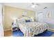 Spacious main bedroom with a king-size bed and coastal-themed bedding at 12049 Hoosier Ct # 202, Hudson, FL 34667