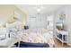 Bright bedroom with a king-size bed and coastal decor at 12049 Hoosier Ct # 202, Hudson, FL 34667