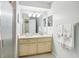 Clean bathroom with light wood vanity and shower at 12049 Hoosier Ct # 202, Hudson, FL 34667