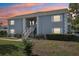 Two-story building exterior at sunset at 12049 Hoosier Ct # 202, Hudson, FL 34667