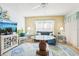 Living room with comfortable seating, glass-top coffee table, and coastal decor at 12049 Hoosier Ct # 202, Hudson, FL 34667
