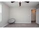 Well-lit bedroom with chair and ceiling fan at 10348 Blue Plume Ct, Riverview, FL 33578