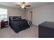 Large bedroom with ceiling fan and ample closet space at 10348 Blue Plume Ct, Riverview, FL 33578