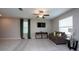 Living room featuring a couch, TV, and ample natural light at 10348 Blue Plume Ct, Riverview, FL 33578