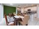 Open concept kitchen and dining area with breakfast bar at 10348 Blue Plume Ct, Riverview, FL 33578