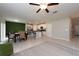 Open concept kitchen and dining area with stainless steel appliances and an island at 10348 Blue Plume Ct, Riverview, FL 33578