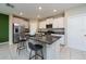 Modern kitchen with granite countertops and stainless steel appliances at 10348 Blue Plume Ct, Riverview, FL 33578