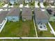 Aerial view of three houses with backyards at 10348 Blue Plume Ct, Riverview, FL 33578