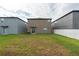 Spacious backyard with a view of the home's exterior at 10348 Blue Plume Ct, Riverview, FL 33578